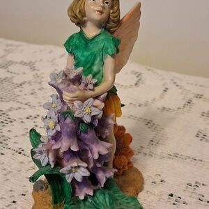 Charming Fairy Figurine with Green and Purple Accents